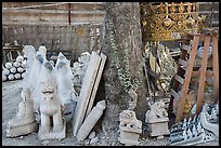 Assortment of sculptures, Marble street. Mandalay, Myanmar ( color)
