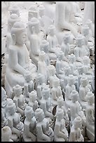 Unfinished white marble buddha statues of various sizes. Mandalay, Myanmar ( color)