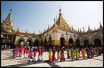 Novices and families walk in procession during Shinbyu ceremony, Mahamuni Pagoda. Mandalay, Myanmar ( color)
