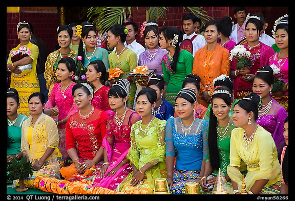 Women pose during novitiation ceremony, Mahamuni Pagoda. Mandalay, Myanmar (color)