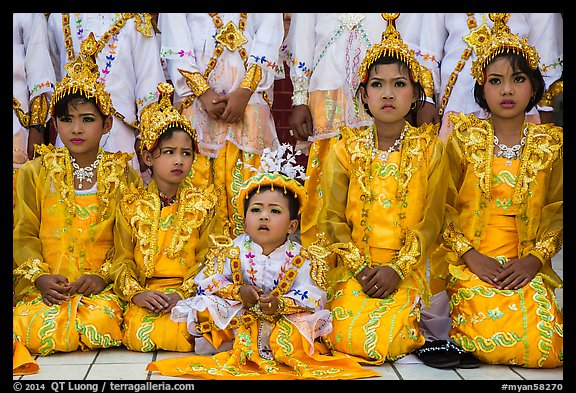 Girls and boy dressed in glittering clothes and make-up to look like princes, Novitiation, Mahamuni Pagoda. Mandalay, Myanmar (color)