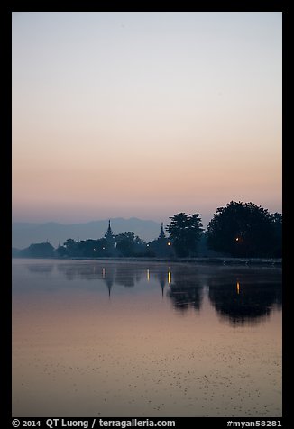 Pastel colors of dawn on Mandalay Fort moat. Mandalay, Myanmar (color)
