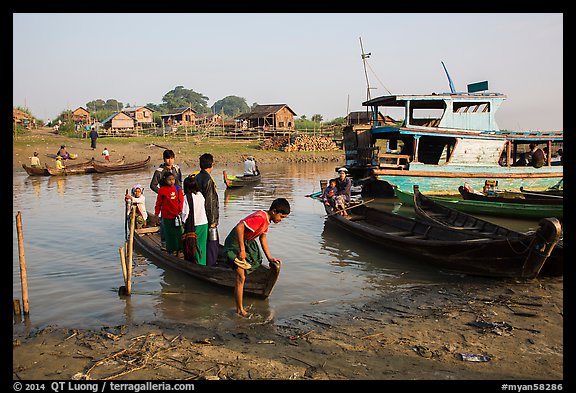 Passengers disembark from boat after short crossing. Mandalay, Myanmar (color)