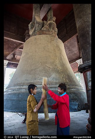 Boy and girl ringing huge bell, Mingun. Myanmar (color)