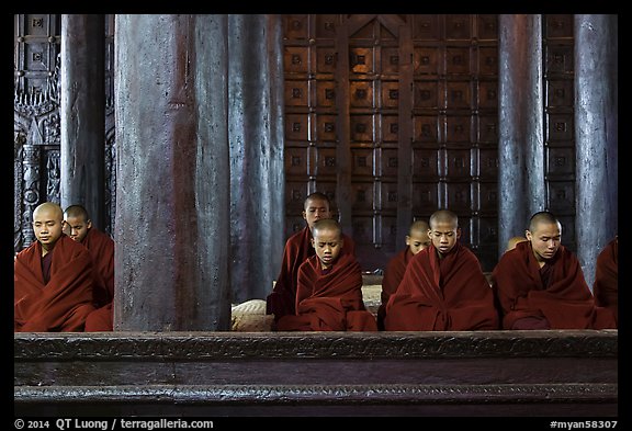Monks during evening prayer. Mandalay, Myanmar (color)