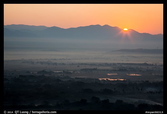 Sun rising over Shan Yoma mountains. Mandalay, Myanmar (color)