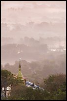 Stupa on Mandalay Hill overlooking misty plain. Mandalay, Myanmar ( color)