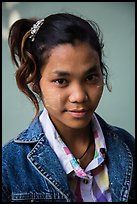 Woman with blue jeans jacket and thanaka paste. Mandalay, Myanmar ( color)