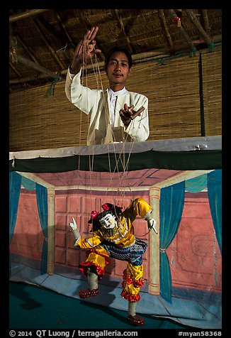 Puppeter handling traditional burmese string marionette. Mandalay, Myanmar (color)