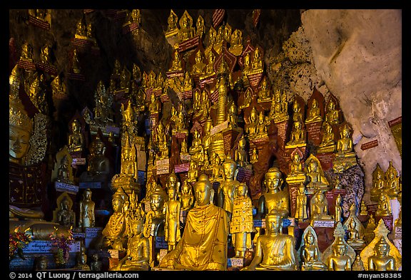 Buddha statues of all sizes near entrance of Pindaya Caves. Pindaya, Myanmar (color)