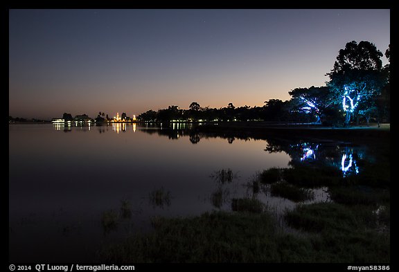 Pone Tanoke Lake at night with illuminated trees and pagoda. Pindaya, Myanmar