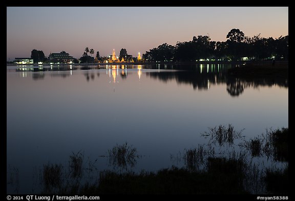 Illuminated pagoda reflected in Pone Tanoke Lake. Pindaya, Myanmar