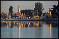 Pagoda reflected in Pone Tanoke Lake at sunrise. Pindaya, Myanmar ( color)