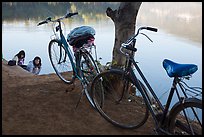 Bicycles and women doing laundry in Pone Tanoke Lake. Pindaya, Myanmar ( color)