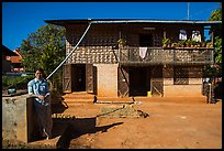 Woman in front of house. Pindaya, Myanmar ( color)