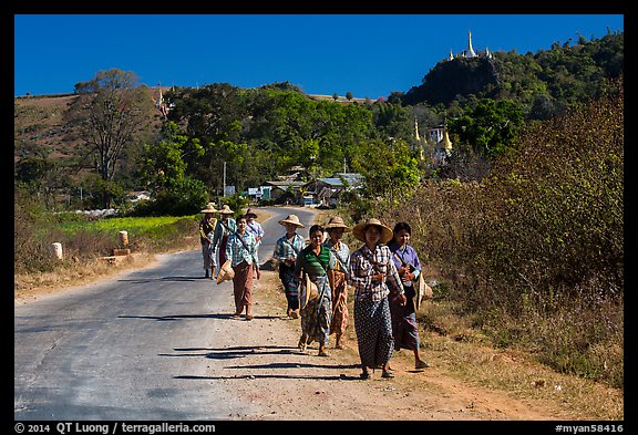 Women walking on road. Shan state, Myanmar