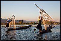 Intha fishermen row with leg and hold conical baskets. Inle Lake, Myanmar ( color)