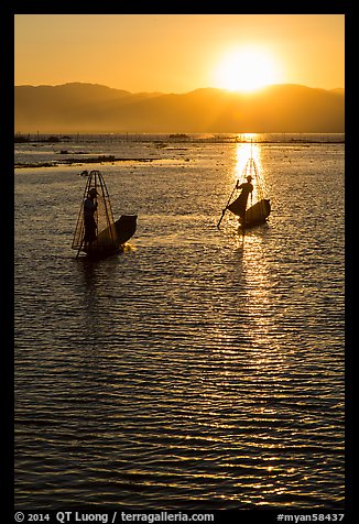 Intha fishermen with setting sun. Inle Lake, Myanmar (color)
