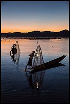 Intha fishermen carrying lanterns at dusk. Inle Lake, Myanmar ( color)