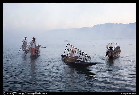 Group of Intha fishermen on misty waters. Inle Lake, Myanmar