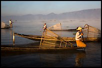 Intha fishermen with conical baskets in morning mist. Inle Lake, Myanmar ( color)