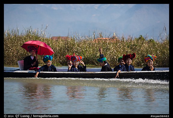 Women with turbans on long tail boat. Inle Lake, Myanmar (color)