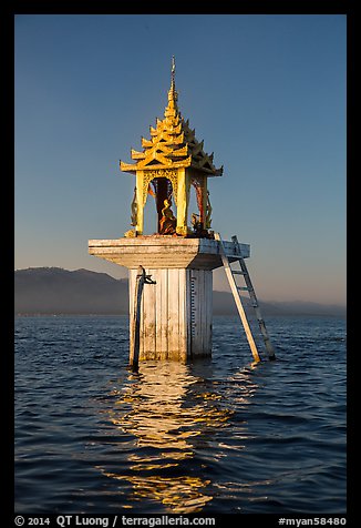 Water level marker topped by shrine. Inle Lake, Myanmar (color)