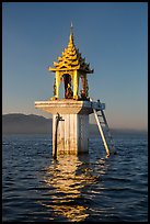 Water level marker topped by shrine. Inle Lake, Myanmar ( color)