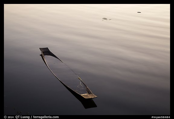 Sunken canoe and ripples. Inle Lake, Myanmar