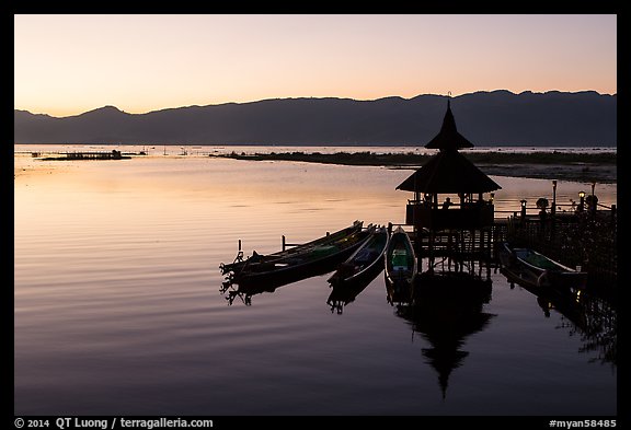 Deck, pavillion, and longtail boats at sunset. Inle Lake, Myanmar (color)