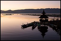 Deck, pavillion, and longtail boats at sunset. Inle Lake, Myanmar ( color)