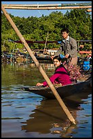 Couple leaving market on their boat. Inle Lake, Myanmar ( color)