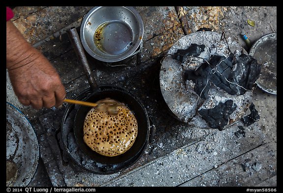 Pancackes cooked on coals. Inle Lake, Myanmar