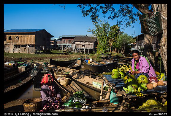 Market, boats, and village houses on stilts. Inle Lake, Myanmar