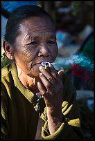 Woman smoking cheerot cigar. Inle Lake, Myanmar ( color)