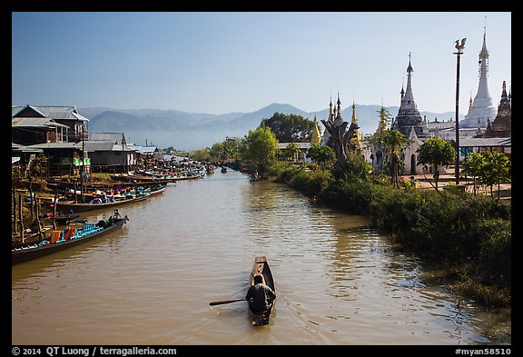 Boats and stupas bordering Ywama Village canal. Inle Lake, Myanmar