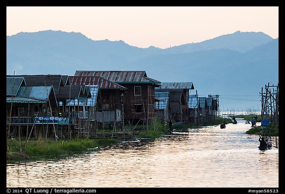 Houses and canal at sunset, Maing Thauk Village. Inle Lake, Myanmar