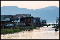 Houses and canal at sunset, Maing Thauk Village. Inle Lake, Myanmar ( color)