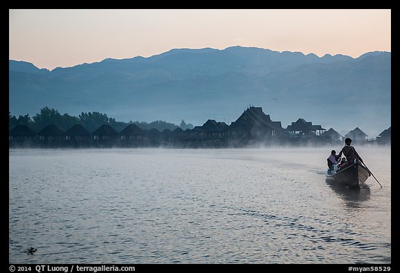 Boat leaving resort in dawn mist. Inle Lake, Myanmar