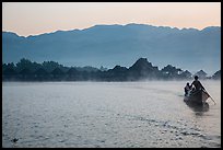 Boat leaving resort in dawn mist. Inle Lake, Myanmar ( color)
