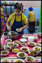 Cooks serving Burmese food. Bago, Myanmar ( color)
