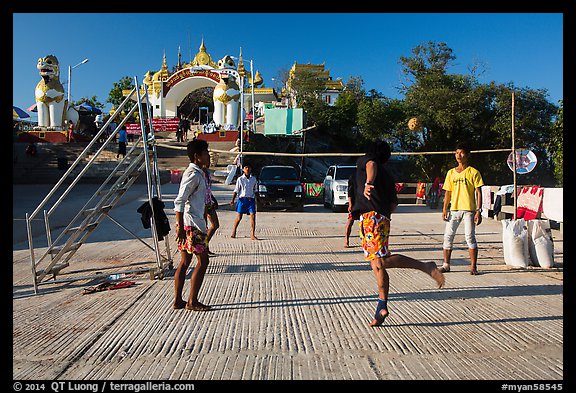 Young men play chin lone (kick volleyball) at Yatetaung. Kyaiktiyo, Myanmar (color)