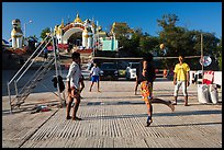 Young men play chin lone (kick volleyball) at Yatetaung. Kyaiktiyo, Myanmar ( color)