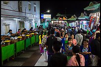 Food vendors and souvenir shops at night, Potemkin village. Kyaiktiyo, Myanmar ( color)