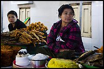 Women at street food stalls, Potemkin village. Kyaiktiyo, Myanmar ( color)