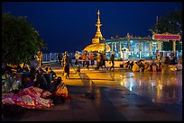Pilgrims wake up after sleeping on plaza behind Golden Rock. Kyaiktiyo, Myanmar ( color)