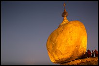 Golden Rock balancing boulder stupa and monks at dawn. Kyaiktiyo, Myanmar ( color)