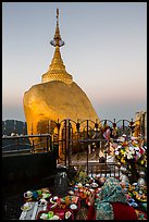 Pilgrim and food offerings behind Golden Rock at dawn. Kyaiktiyo, Myanmar ( color)