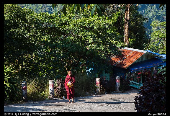 Monk walking barefoot on the path to the Golden Rock. Kyaiktiyo, Myanmar (color)