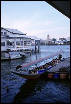 Evening commute, long tail taxi boat on Chao Phraya river. Bangkok, Thailand (color)